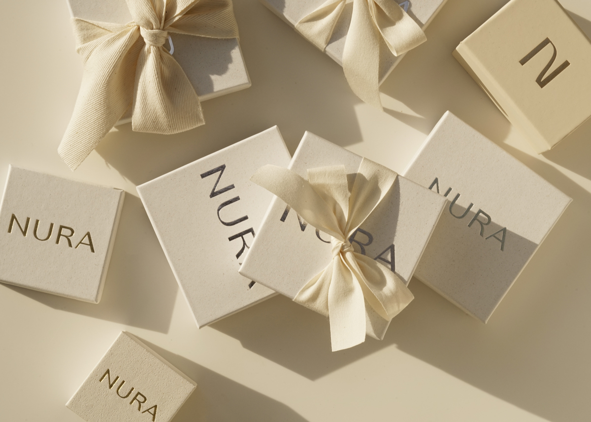 jewellery boxes wrapped in beige riboons