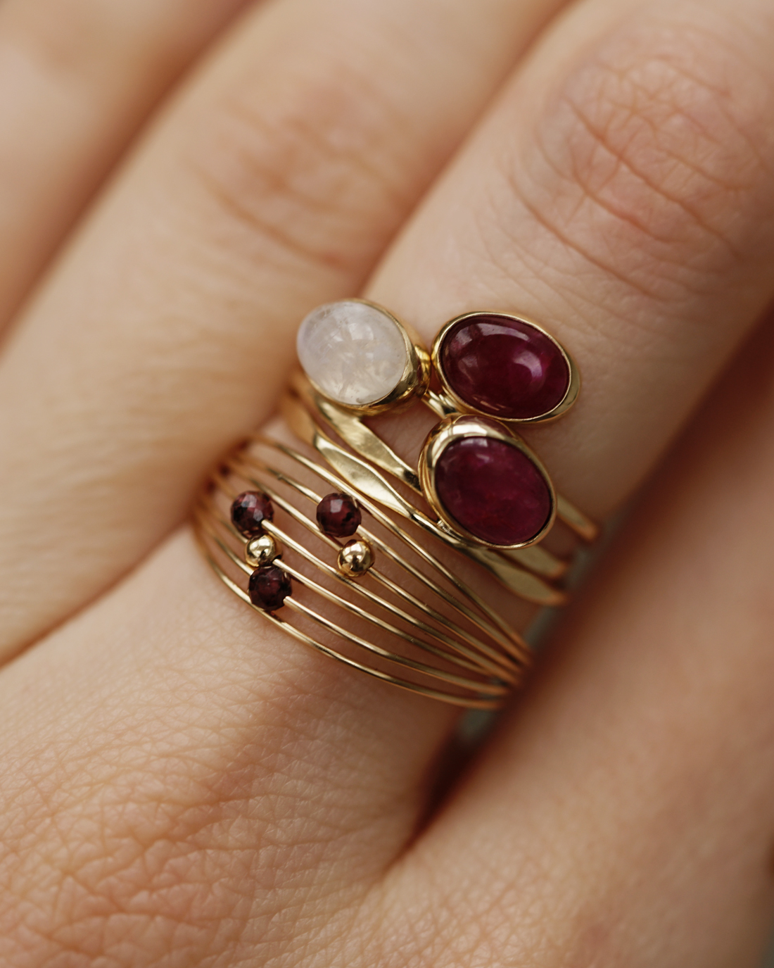 magenta ruby gemstone rings on a hand