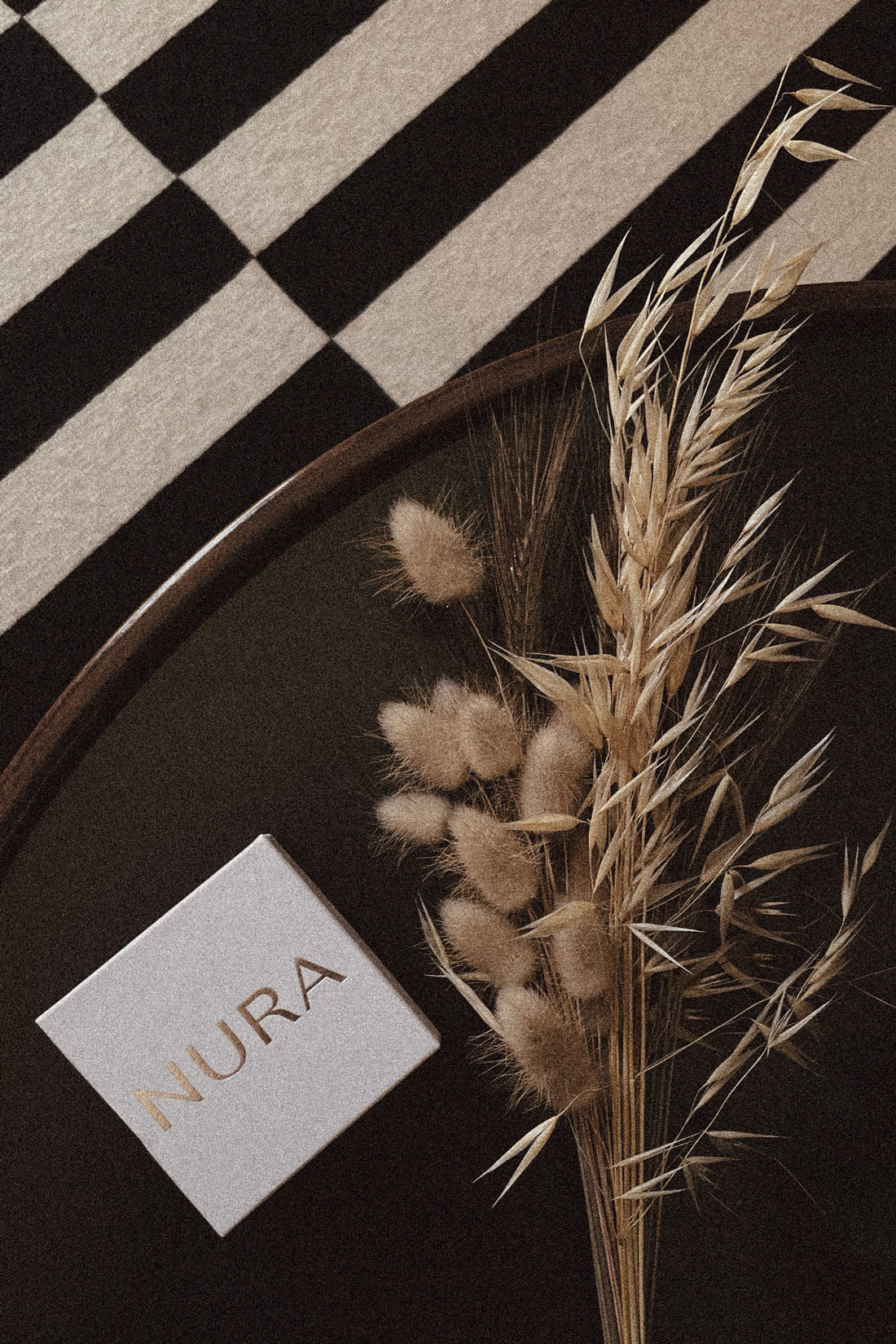 nura box and dry flowers